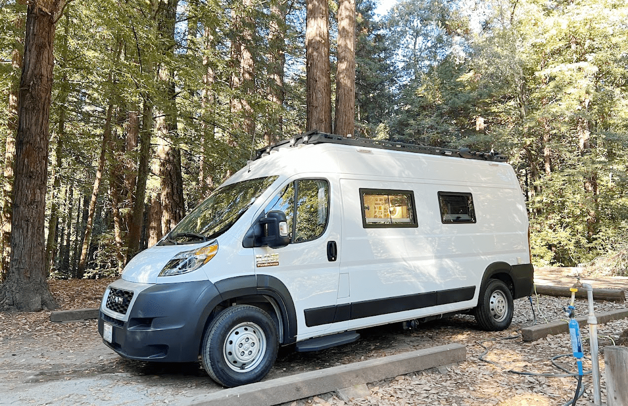 LIV Discovery custom campervan in a forest campsite